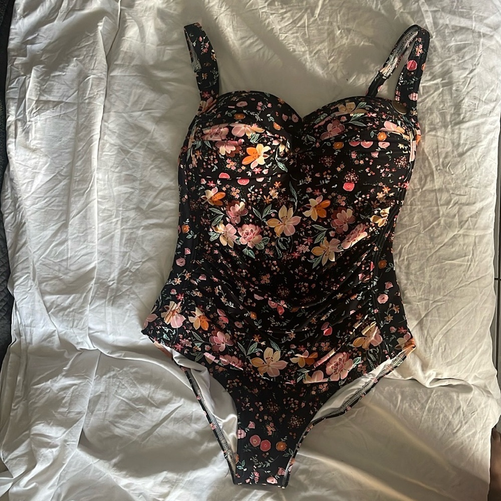 This is an Australian brand swimsuit with tummy control to show curves